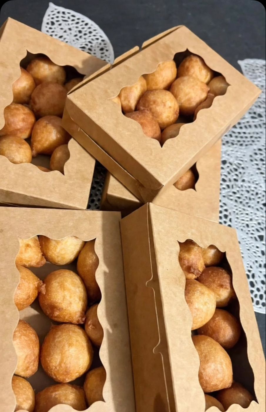 Boxes of golden small chops and pastries
